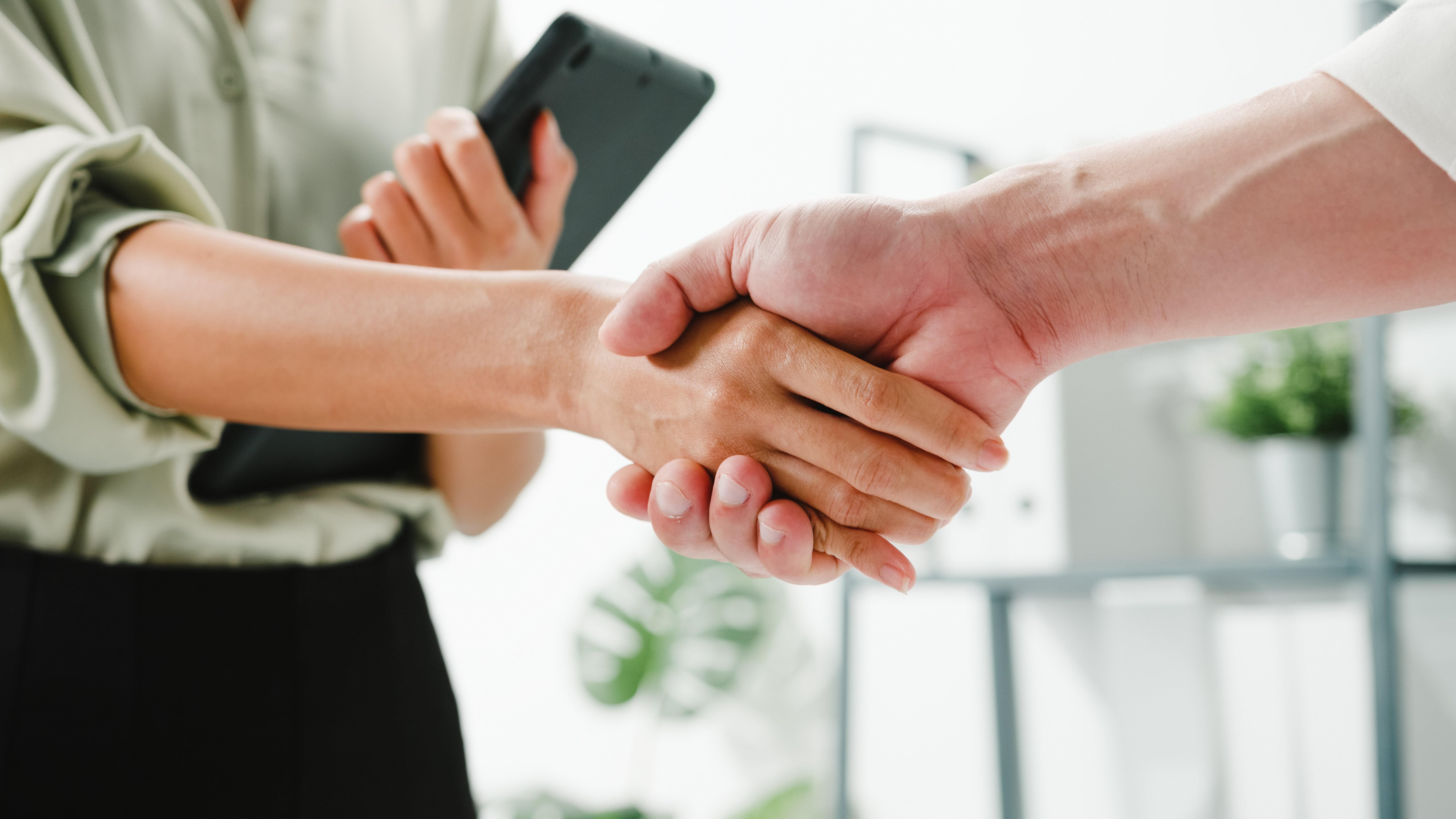 multiracial-group-young-creative-people-smart-casual-wear-discussing-business-shaking-hands-together